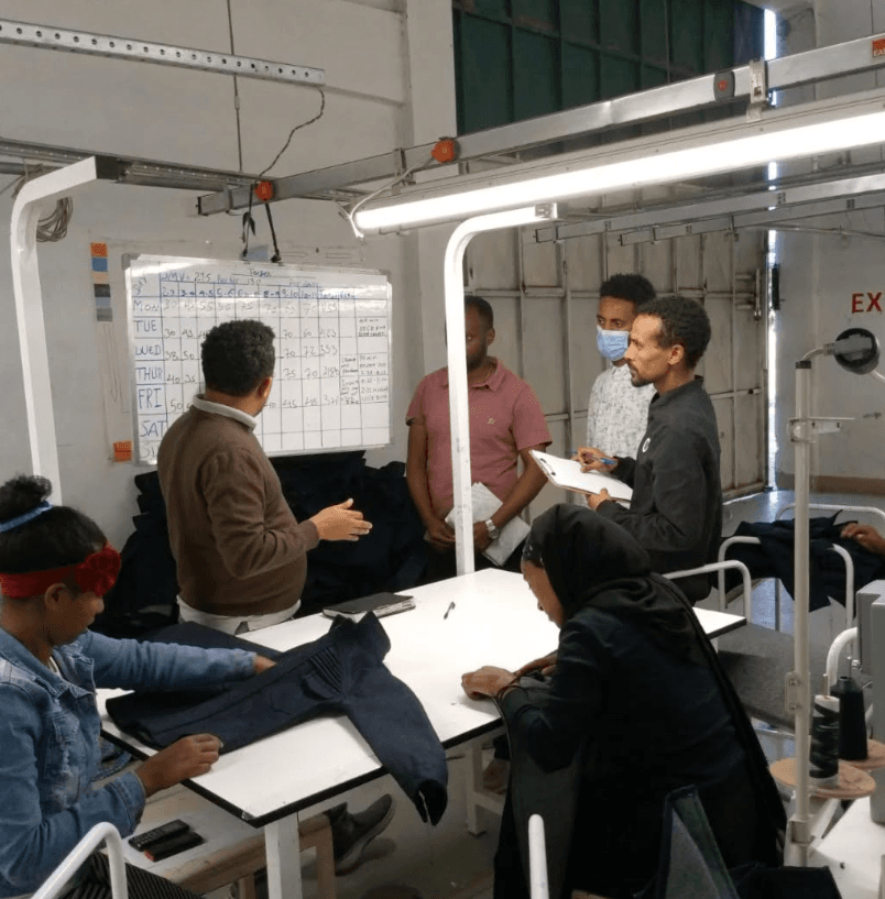 Diverse workers collaborating in a modern factory